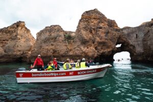 People in a boat on a cave tour